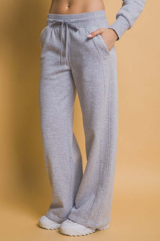 Comfy gray drawstring wide leg sweatpants with pockets, perfect for casual wear and lounging.