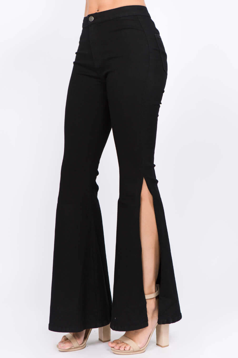 Black American Bazi Side Slit Flare Jeans with flattering flare legs and daring side slits, paired with nude heels for a stylish look.