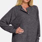 Zenana brushed melange hacci sweater with 7-button placket, featuring a stylish hi-low hem. Cozy oversized fit for comfort and style.