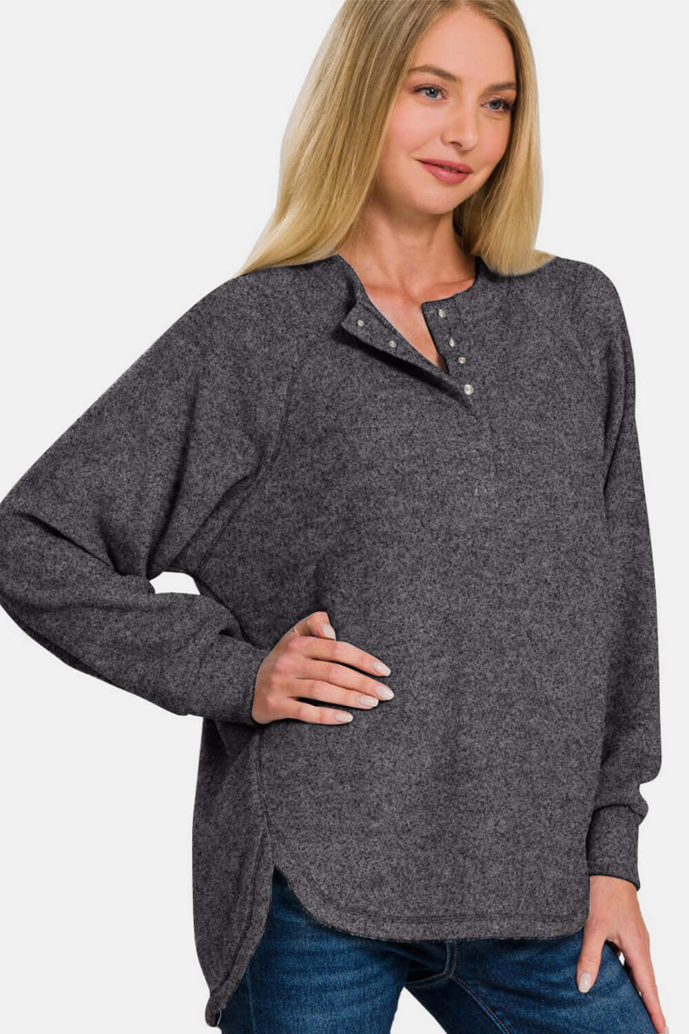 Zenana brushed melange hacci sweater with 7-button placket, featuring a stylish hi-low hem. Cozy oversized fit for comfort and style.