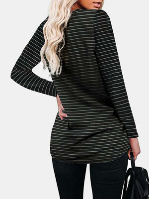 Woman wearing Bella Road round neck long sleeve t-shirt with slight stretch and pocket, black color with white stripes, back view.