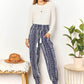 DOUBLE TAKE Geometric Print Tassel High-Rise Pants at Bella Road