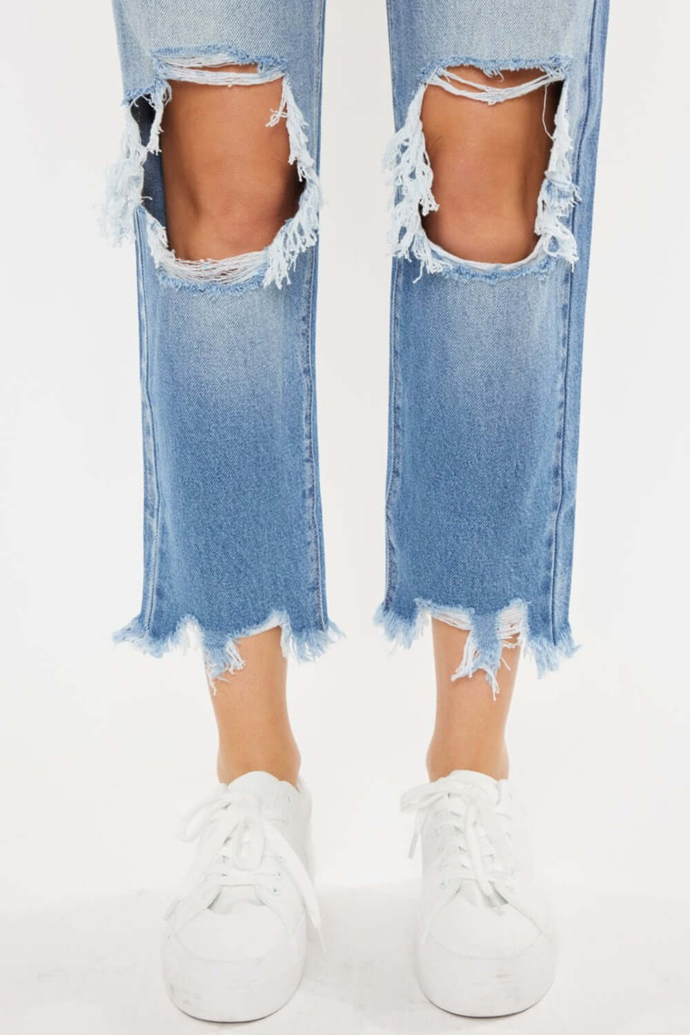 High Waist Chewed Up Straight Mom Jeans with distressed holes and frayed edges showcasing a trendy and edgy vintage-inspired style