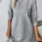 Model in a gray textured long sleeve mini dress, showcasing a stylish basic look perfect for casual outings.