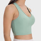 Side view of Millennia Scoop Neck Wide Strap Active Tank in mint green, highlighting its stylish design and support.