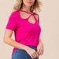 Woman wearing fuchsia Cutout Asymmetrical Neck Short Sleeve T-Shirt with stylish cutout details and blue jeans, showcasing a casual yet edgy look.