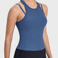 Stylish blue Millennia Cutout Round Neck Racerback Tank top with unique cutout design for active wear and maximum comfort.