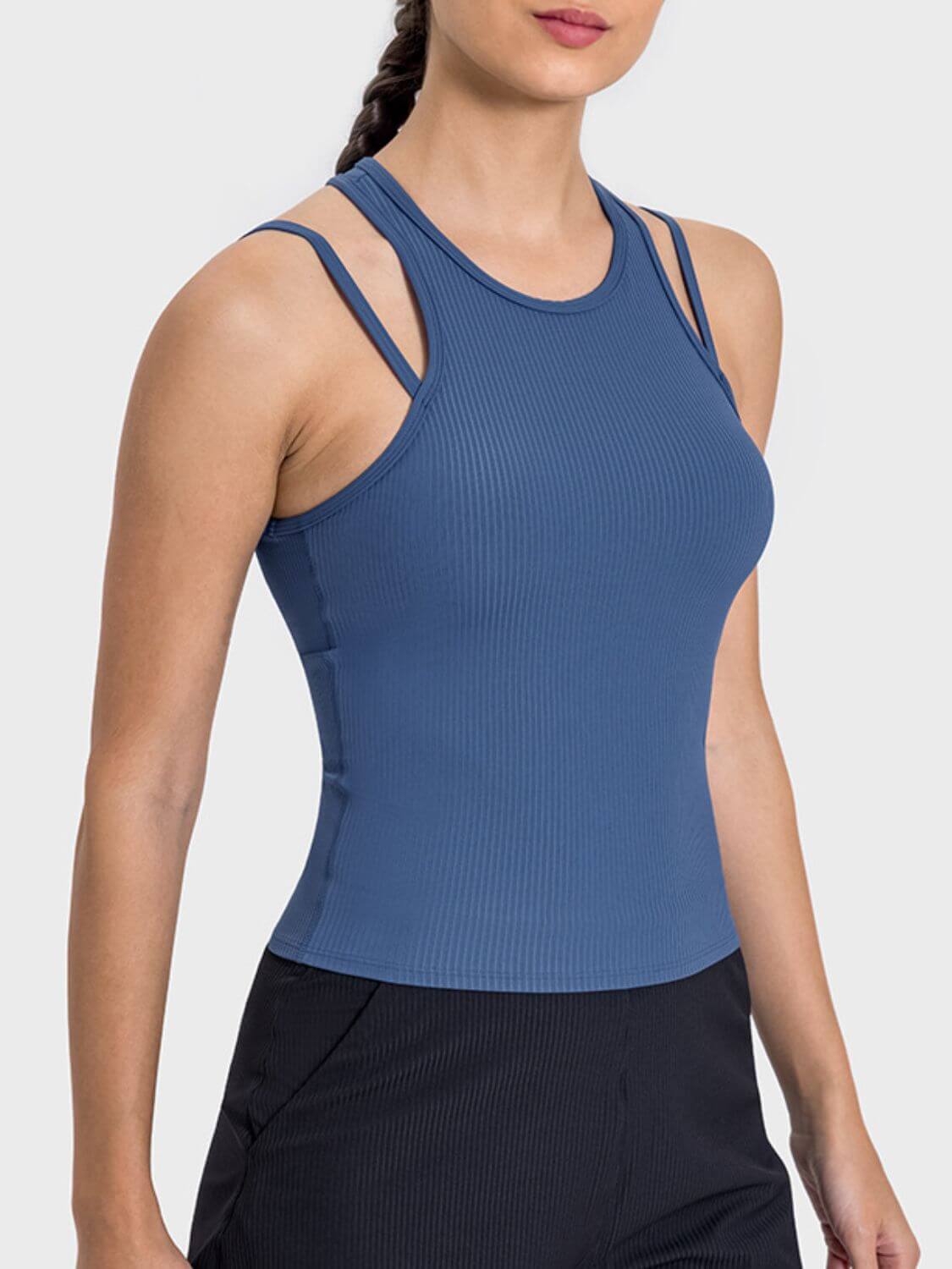 Stylish blue Millennia Cutout Round Neck Racerback Tank top with unique cutout design for active wear and maximum comfort.