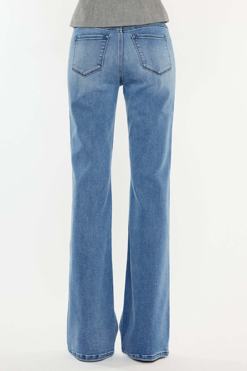 Ultra High Rise Cat's Whiskers Jeans in light blue denim with a flattering high-waisted silhouette, shown from the back, perfect for a chic look.