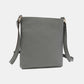 Nicole Lee USA Nikky Crossbody Bag in smooth eco-leather, back view showcasing slimline design and durable craftsmanship.