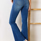 Woman wearing Kancan High Rise Raw Hem Flare Jeans with frayed hem and chic retro flare cut, showcasing a flattering silhouette