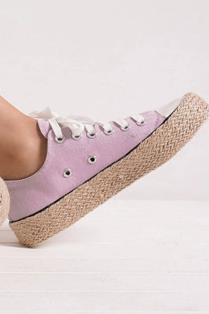 Stylish pink lace-up sneakers with woven espadrille sole, perfect for summer vibes and casual chic outfits.