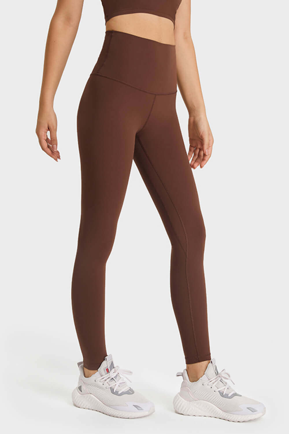 Ultra soft high waist leggings in rich brown, paired with stylish sneakers for a chic athleisure look.