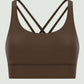 Brown crisscross scoop neck active tank, stylish and breathable for workouts, showcasing trendy design and comfort.