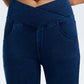 Dark blue bootcut jeans with a crossover high waist design and front pockets, showcasing stylish comfort and flexibility.