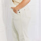 Woman wearing Taylor High Waist Overalls with pockets by Judy Blue Jeans, paired with a neutral tank top.