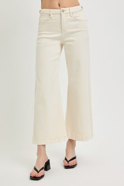 Stylish cropped bootcut jeans in cream, perfect for casual and trendy looks paired with heels.