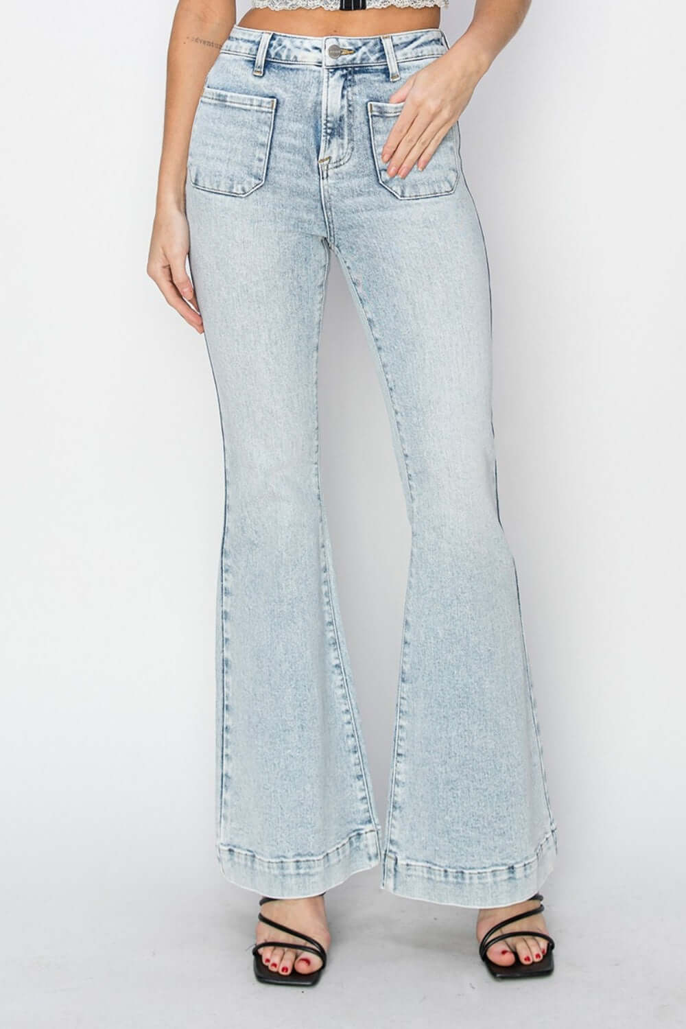 High Rise Front Patch Pocket Flare Jeans by Risen Jeans with trendy design, front patch pockets, and flattering fit. Perfect casual or fashionable look.