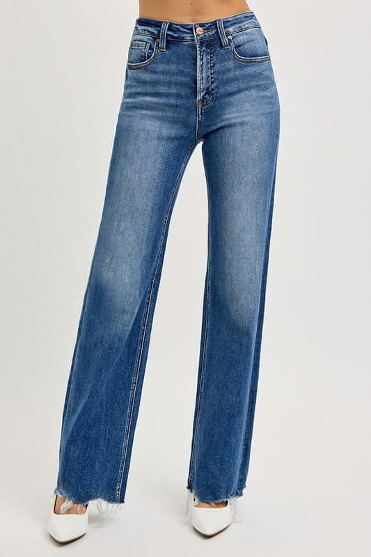 High rise raw cut jeans with tummy control, designed for a slim look and stylish comfort.