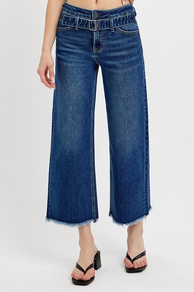 Stylish RISEN Raw Hem Wide Leg Jeans with buckle details, featuring a relaxed fit and edgy raw hem.