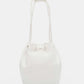 Nicole Lee USA Amy Studded Bucket Bag crafted from pebbled vegan leather with drawstring closure and metal feet for added durability.