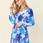 DOUBLE TAKE Full Size Floral Long Sleeve Romper with Pockets at Bella Road