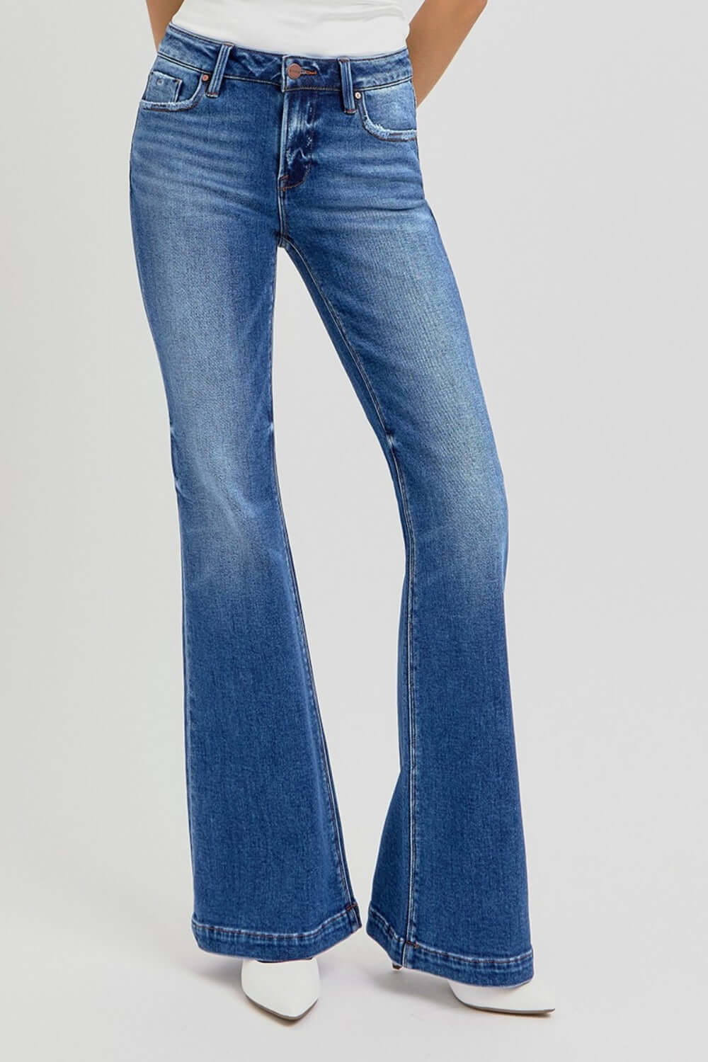 Low rise flare jeans with pockets, vintage style, slightly stretchy denim, front view, perfect with a tucked-in blouse or graphic tee.