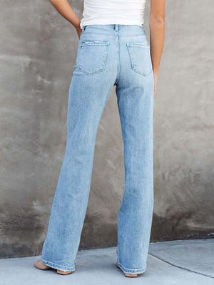 Back view of woman wearing Washed Straight Leg Jeans showing relaxed fit and washed denim style