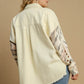 Back view of Umgee Plus Size Distressed Button Up Jacket with stylish raw hem and trendy patterned sleeves.