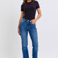 Stylish model in mid-rise bootcut jeans with thermal lining, paired with a sleek black top. Perfect for any occasion!