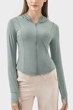 Millennia Pocketed Zip Up Hooded Long Sleeve Active Outerwear in soft green, perfect for workouts and casual outings.