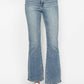 Plus size bootcut jeans with tummy control and embroidered back pockets, styled for a trendy look.