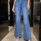 Woman modeling Bella Road Bootcut Jeans with Pockets, featuring a stylish flair and slightly stretchy fit in a modern setting.