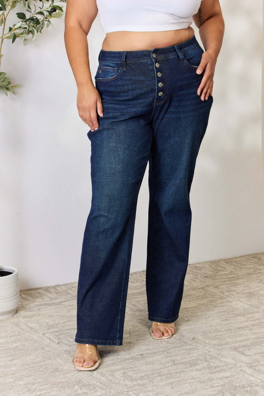 Plus size model wearing high-waisted Judy Blue Button-Fly Straight Jeans, showcasing flattering fit and dark wash denim.