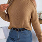 Bella Road Cable-Knit Turtleneck Cold Shoulder Sweater in tan, featuring a stylish cut-out design. Cozy and chic for chilly days.