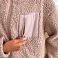 Cozy Ivy Lane fuzzy jacket with zip-up closure and front pocket in soft, textured fabric. Perfect for chilly days.