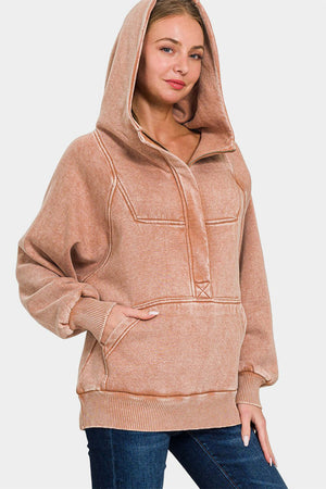 Woman wearing Zenana acid wash fleece kangaroo hoodie with cozy hood and pocket, showcasing a trendy and casual style.