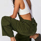 Woman wearing army green Bella Road Pocketed Wide Strap Denim Overalls, showing stylish back design and pockets.