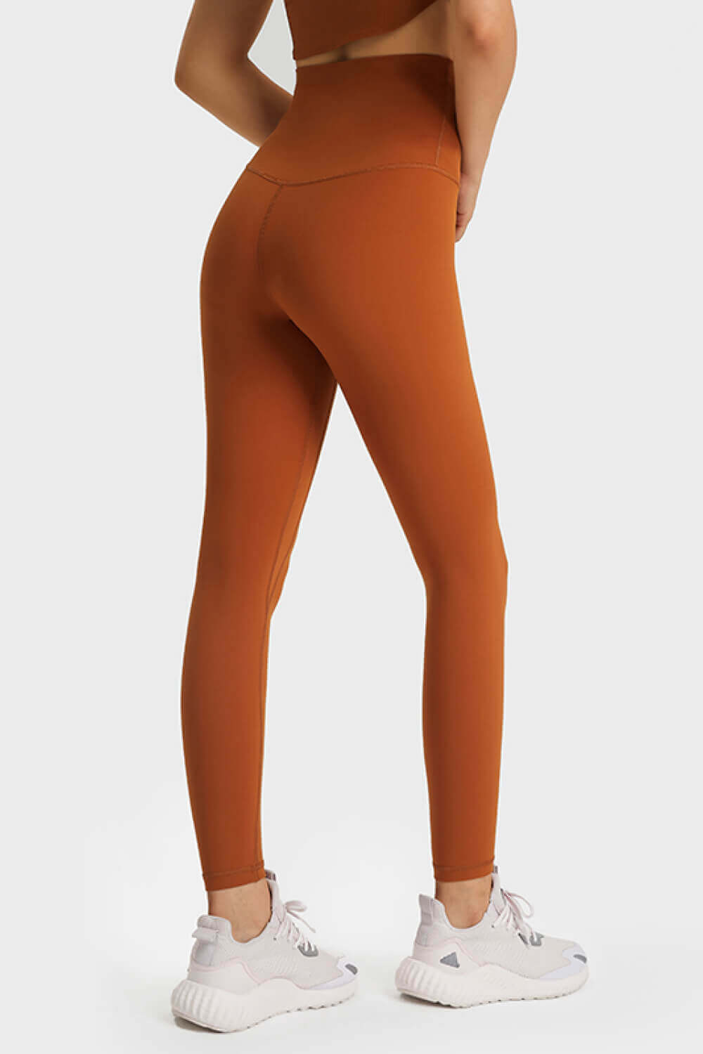 Back view of Millennia Ultra Soft High Waist Leggings in rust color, showcasing the snug fit and high waistband.