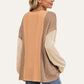 Woman wearing Double Take Texture Contrast Round Neck Long Sleeve T-Shirt in trendy color combo, ideal for stylish layering.