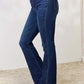 Woman wearing Slim Bootcut Jeans that hug curves with a flattering bootcut leg, perfect for dressing up with heels or casual with sneakers.