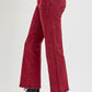 High rise straight jeans with patch pockets in red, featuring classic design and comfortable fit, styled with black boots.