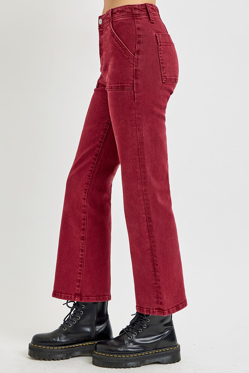 High rise straight jeans with patch pockets in red, featuring classic design and comfortable fit, styled with black boots.