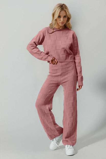 Woman wearing pink Double Take Checkered Round Neck Top and Pants Set, full size leisurewear with a stylish, edgy twist.