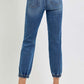 High rise ankle jogger jeans with elastic cuffs shown from the back, showcasing soft stretchy denim and sleek silhouette.