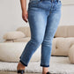 Woman wearing release hem cropped bootcut Judy Blue jeans with sandals