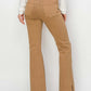 Back view of Bailey High Waist Side Slit Flare Jeans in tan, highlighting flattering fit and edgy slit detail - perfect Risen Jeans!