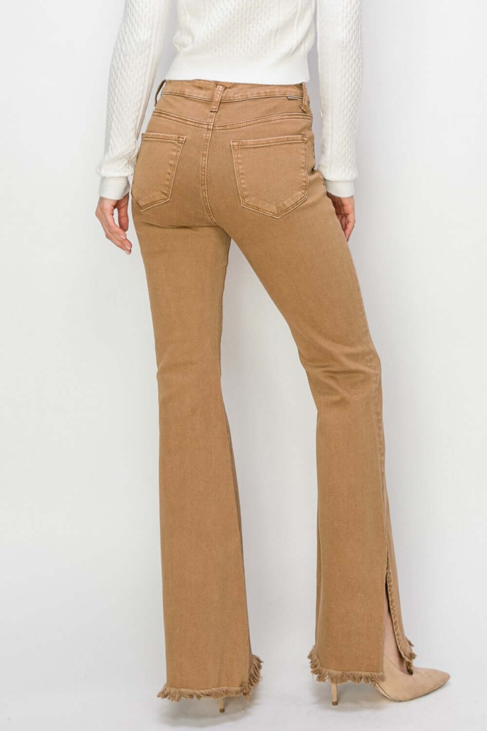 Back view of Bailey High Waist Side Slit Flare Jeans in tan, highlighting flattering fit and edgy slit detail - perfect Risen Jeans!