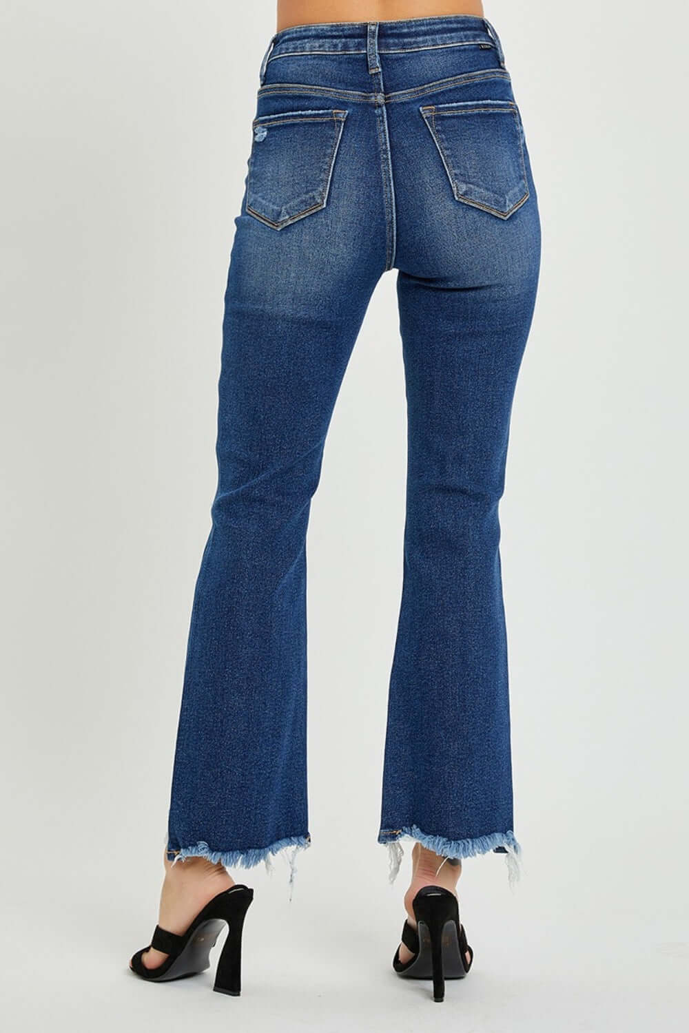 High Rise Distressed Crop Flare Jeans by Risen Jeans – Back View of Chic and Edgy Denim with Flared Hem and Heels