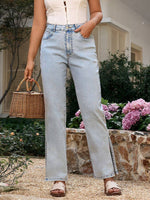 Light wash Bella Road side slit straight leg jeans with pockets, styled with a basket and surrounded by flowers.